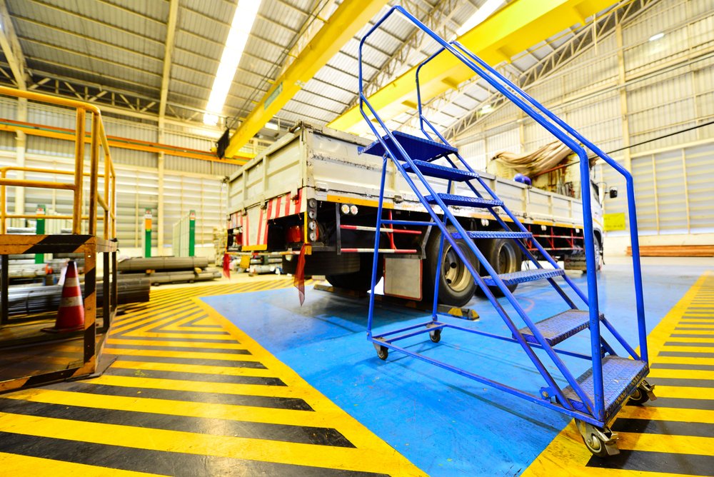 Blue,Ladder,With,Wheels,For,Entering,The,Truck.